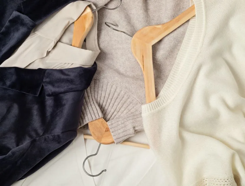 neutral wardrobe pieces laid out together to build outfits